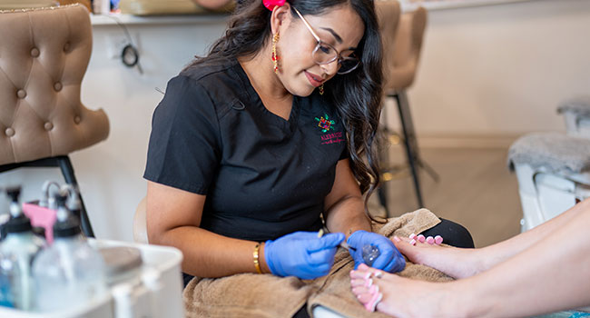 a woman getting a pedicure