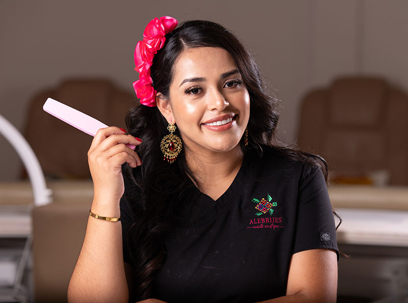 a woman holding a nail file