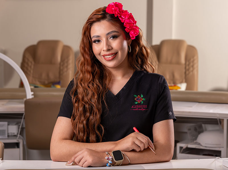 a woman with red hair and a flower in her hair